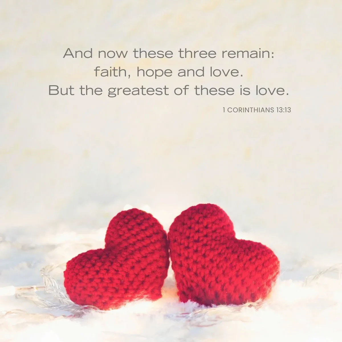 two red knit hearts set side by side — Bible verse about love and for Valentine's day