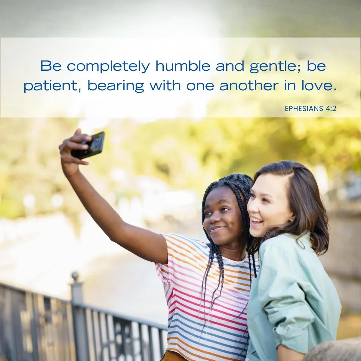 two friends taking a picture together — Bible verse about being empathetic