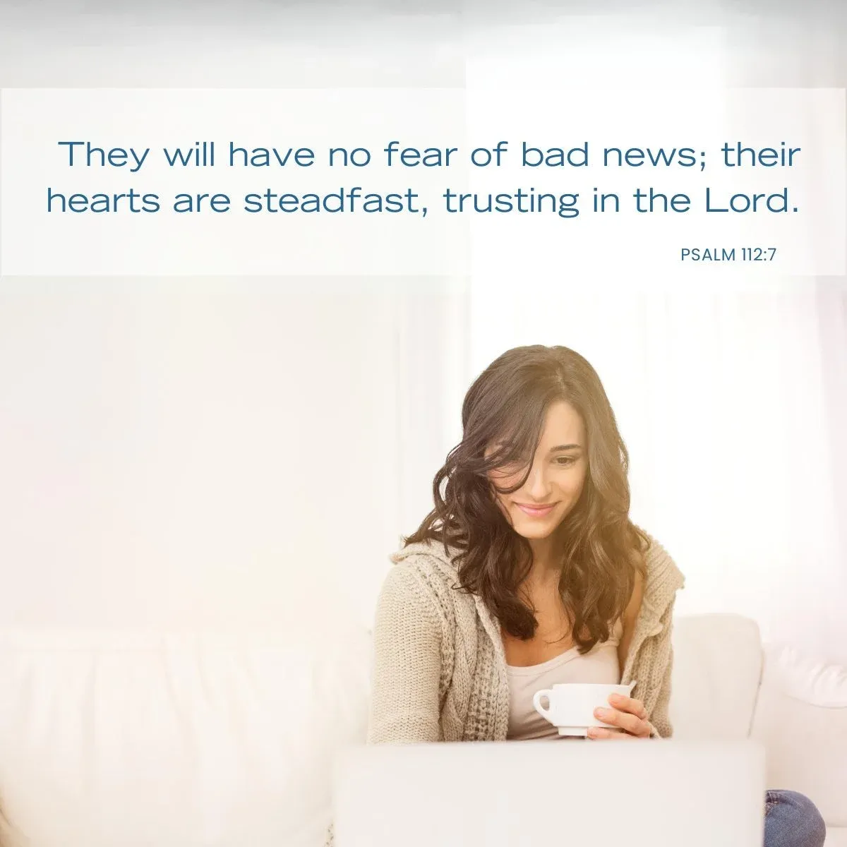woman holding a cup of tea while looking at laptop — Bible verse about self esteem and confidence